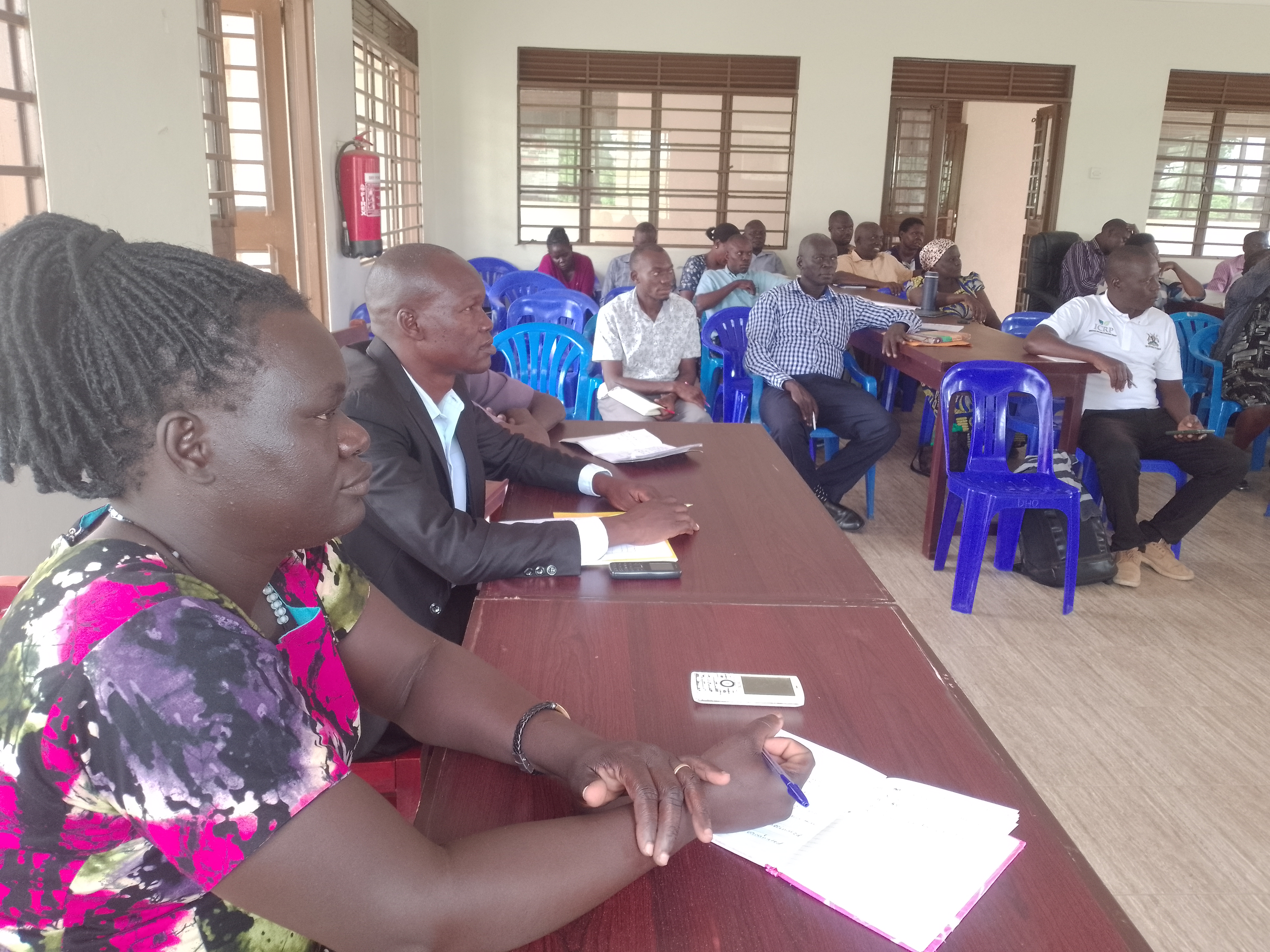 The district holders attending a meeting at the district hall The district holders attending a meeting at the district hall